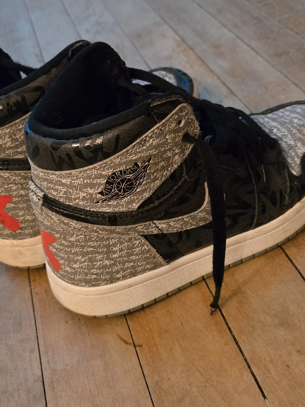 Nike Air Jordan 1 Mid in Black and Gray Script